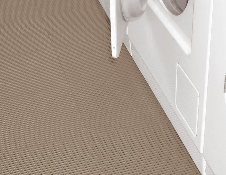 Laundry room flooring with a washer and dryer