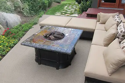 A backyard patio with Beige Deck Tile